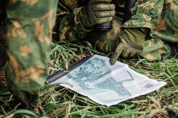 Ranger commander explains the combat mission and points to a  ma