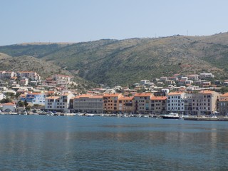 Sea, port, village, mountains and sky