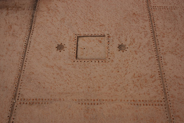 Detail of metal plates riveted together to make a swimming pool at the historic Humberstone...