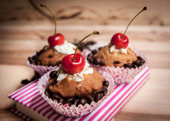 tasty muffin cakes with chocolate, spices and coffee seeds, close up