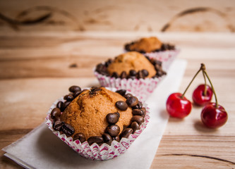 tasty muffin cakes with chocolate, spices and coffee seeds, close up