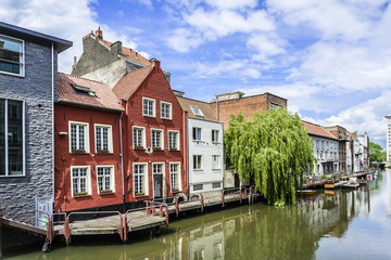 Fototapeta na wymiar View of picturesque houses along channel in Ghent. Belgium.