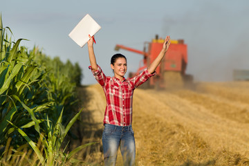 Fototapeta na wymiar Farmer woman in wheat field