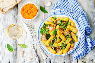 potatoes pumpkin gnocchi with bacon, cilantro and mint