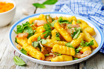 potatoes pumpkin gnocchi with bacon, cilantro and mint