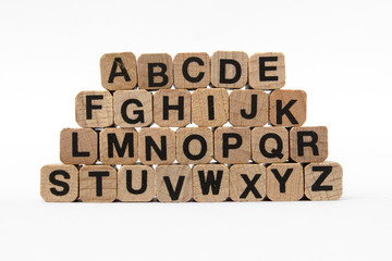 alphabet, letters on wooden cubes, isolated on white background