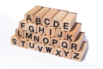 alphabet on wooden cubes, isolated on white background
