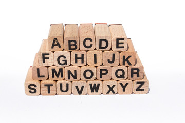 alphabet, letters on wooden cubes, isolated on white background