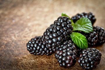Blackberries on wooden background