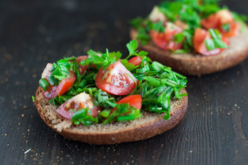 Italian tomato bruschetta with chopped vegetables, herbs and oil