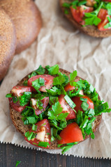 Italian tomato bruschetta with chopped vegetables, herbs and oil