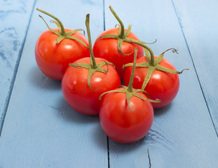 tomatoes on a blue board