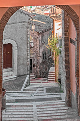 Naklejka premium perspective of stairway in alley 
