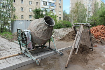 Old cement mixer.
Industrial cement mixer machine at construction site.