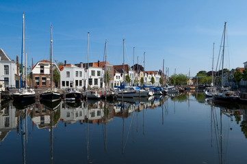 Fototapeta na wymiar Boats in Goes city harbor, Netherlands
