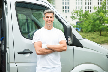 Painter With Arms Crossed In Front Of Van