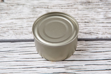 Short aluminum can over rustic weathered wooden background