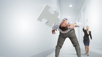 Man evading flying puzzle 