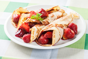 Traditional crepes served with strawberries