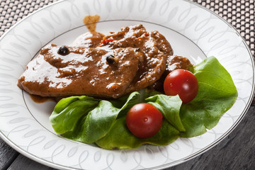 Pork chop with sauce and vegetables