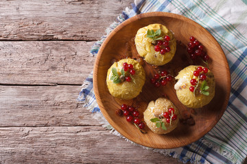 baked apples with honey and currant. on a wooden. horizontal top view

