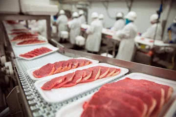 Foto auf Acrylglas Pork chops at handling factory packaging plant raw organic © elnariz