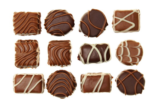 Various chocolates candies on white background