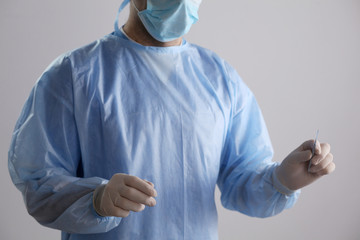 Man surgeon holds a scalpel in an operating room