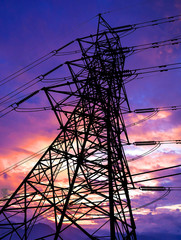 Silhouette of high voltage transmission towers.