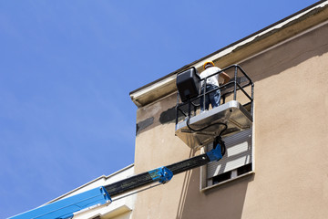 Worker on lift platform