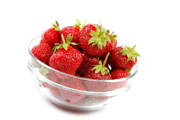 Fresh strawberries in glass bowl.