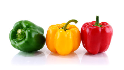 three color peppers isolated on white background