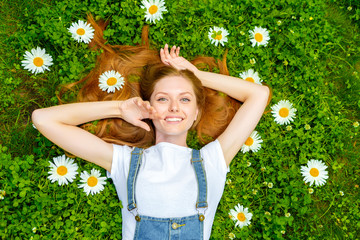 Beautiful smiling red-haired young woman