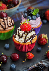Set of different delicious cupcakes