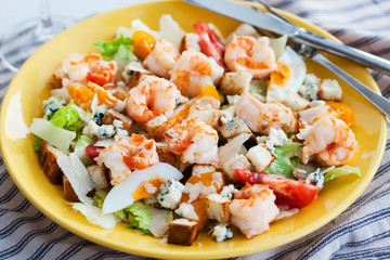 Fresh shrimps, eggs, croutons and vegetables salad