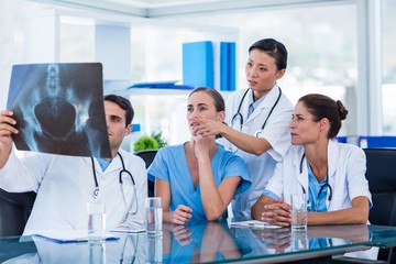 Fototapeta premium Team of doctors looking at xray