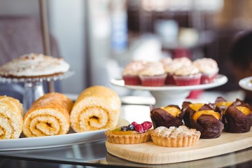 Close up of pastries on plates on counter