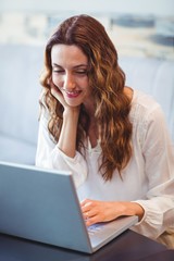  Young woman using laptop