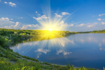 Calm beautiful rural landscape with a lake 