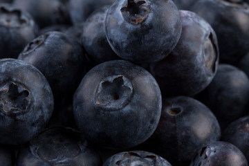 Blueberries on stone plate background