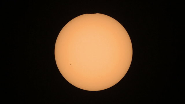 Sun eclipse from the 20.03.2015. - Moon silhouette entering sun disk. Taken trough my telescope with 1000mm focal length. In the lower left center can be seen a group of sunspots.