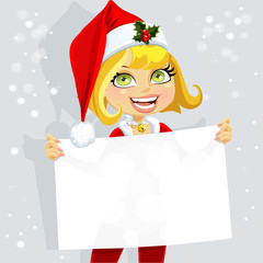 Cute girl in Santa suit hold blank seductive banner for your tex