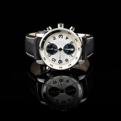 Naklejka premium Swiss watches on black background. Product photography.