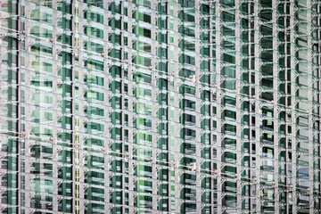 Contemporary architectural detail. An abstract full-frame detail of a glass window structure to a modern skyscraper.