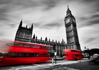 Fototapeta na wymiar London, the UK. Red buses and Big Ben, the Palace of Westminster. Black and white