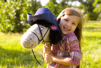 oung cowboy shirt and a toy horse
