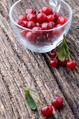 Ripe cherry lying on an old wooden table