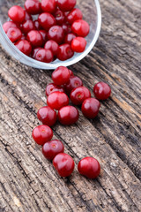 Ripe cherry lying on an old wooden table