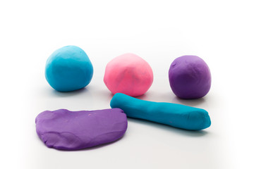 pieces of plasticine on white background