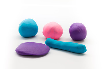 pieces of plasticine on white background